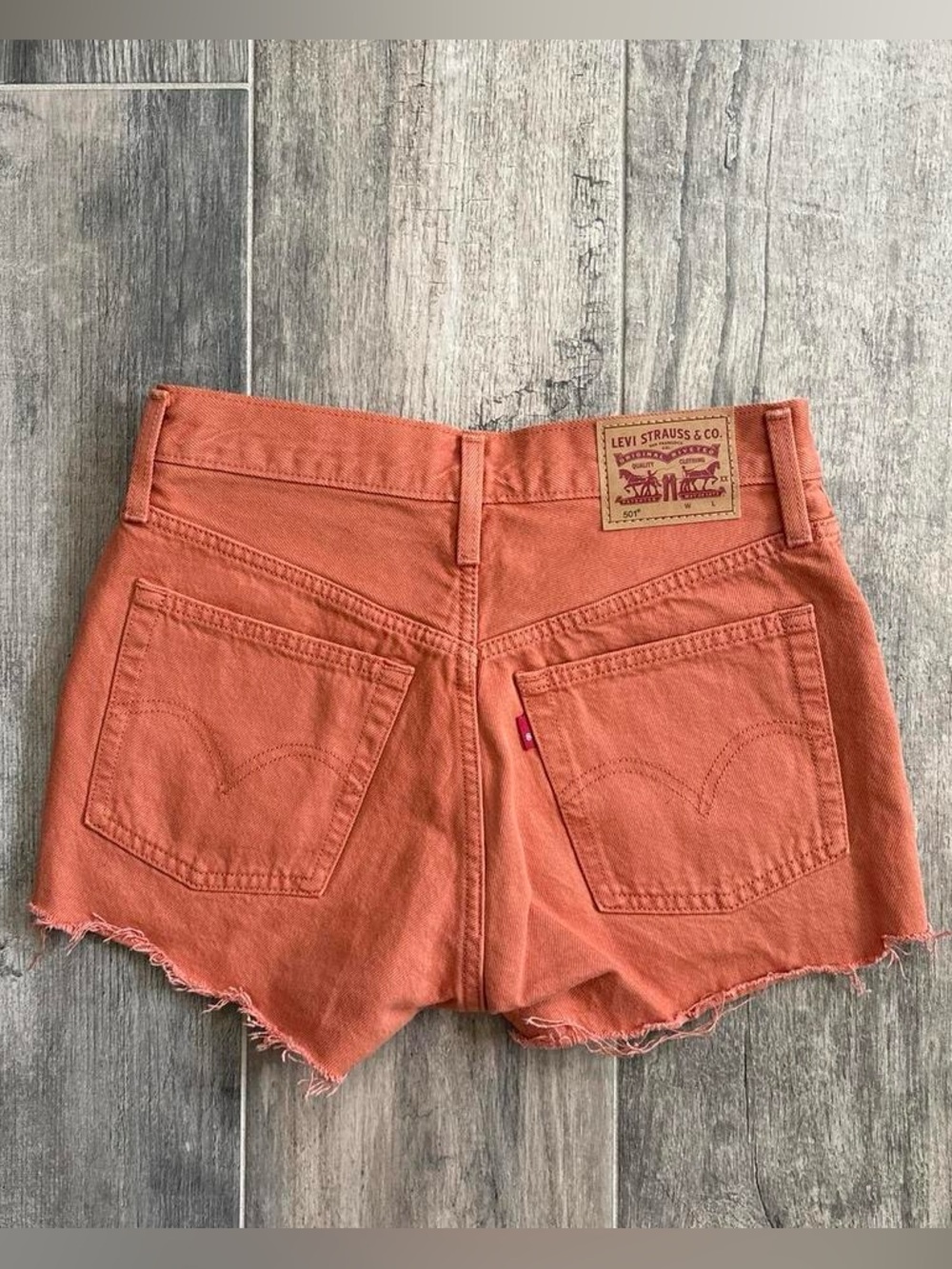 Levi's Orange Cutoff Denim Shorts with Frayed Hem